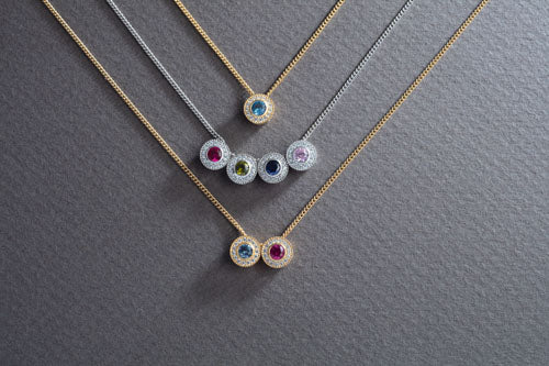 Platinum Finish Sterling Silver Round Simulated Birthstone Pendant with Simulated Diamonds