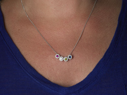 Platinum Finish Sterling Silver Round Simulated Birthstone Pendant with Simulated Diamonds